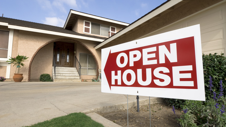 open house sign on lawn