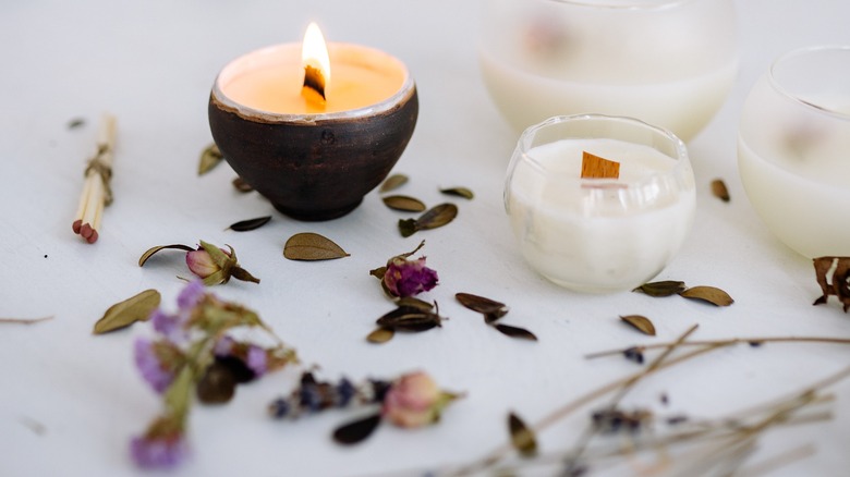 small candles with pressed flowers