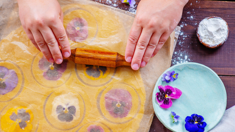 woman making pansy cookies