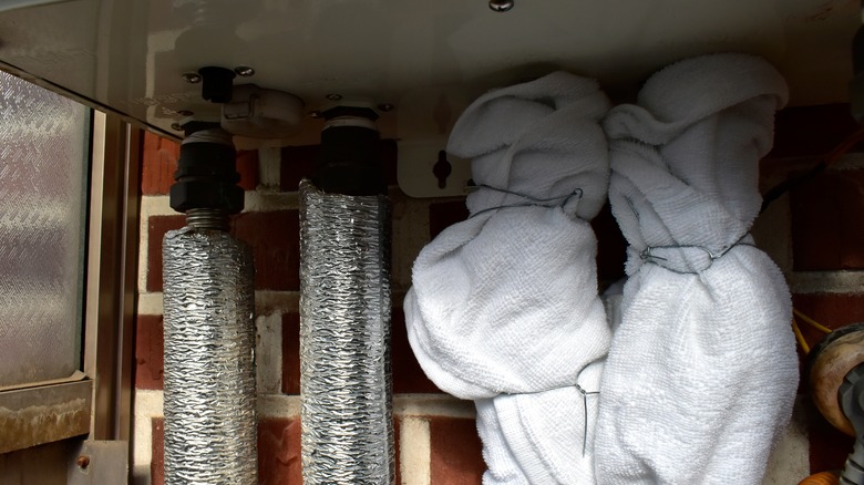 blankets insulating pipes against cold