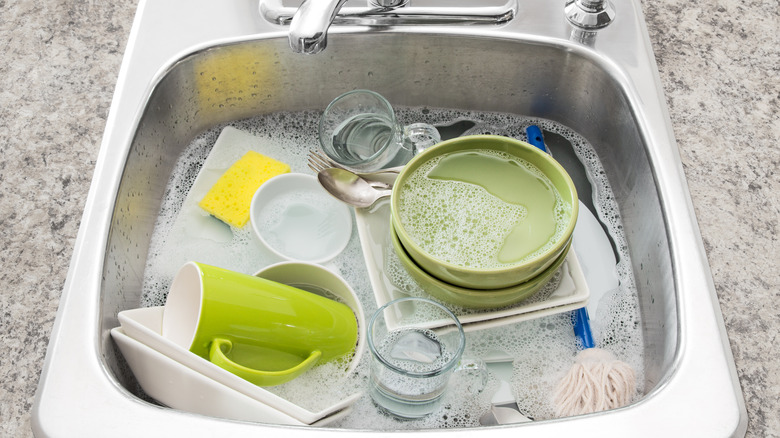 Dishes soaking in sink