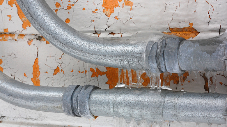 Frozen pipes with icicles