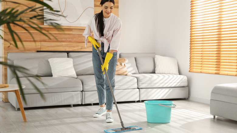 woman mopping laminate flooring