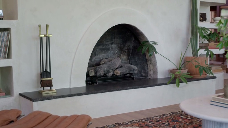 white fireplace with arch 