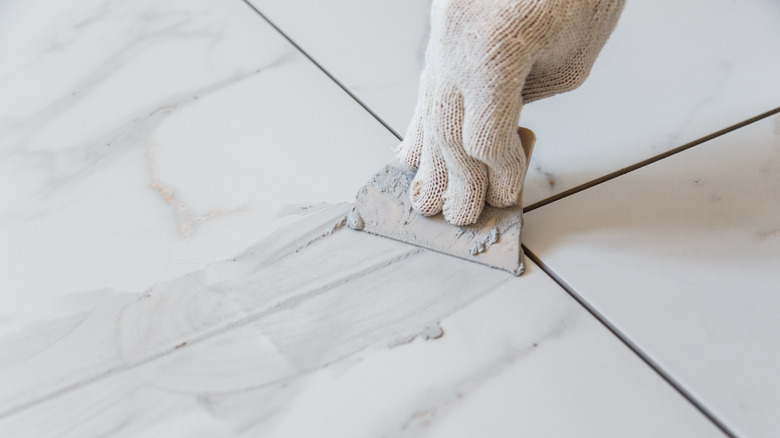 hand re-grouting tile