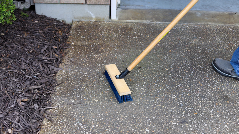 sweeping concrete driveway