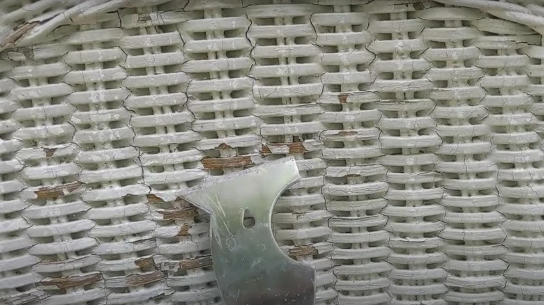 paint scraper on wicker furniture