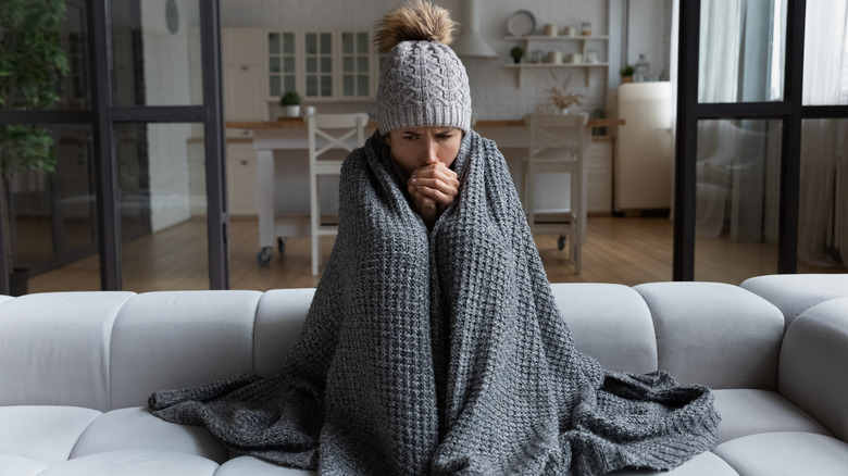 Woman feeling cold indoor