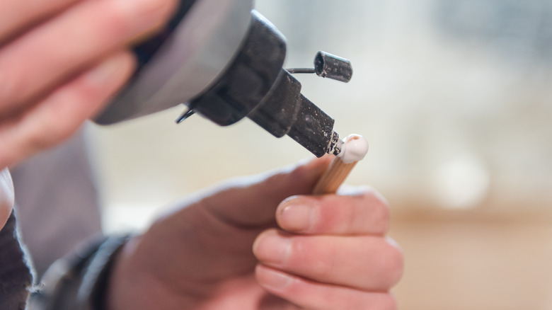 Applying glue to dowel