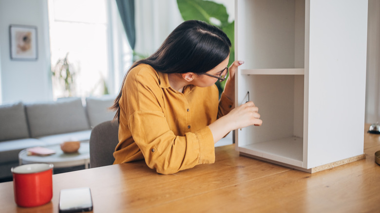 Woman looking at IKEA piece