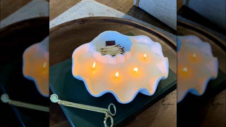 Chips and dip bowl repurposed into a candle with match holder