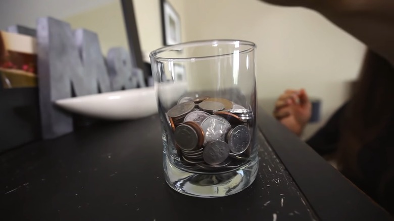 Coins in glass jar