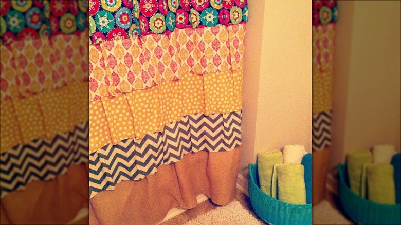 Colorful patchwork ruffle curtain in bathroom