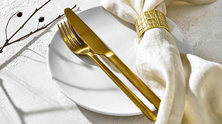 gold and white table setting