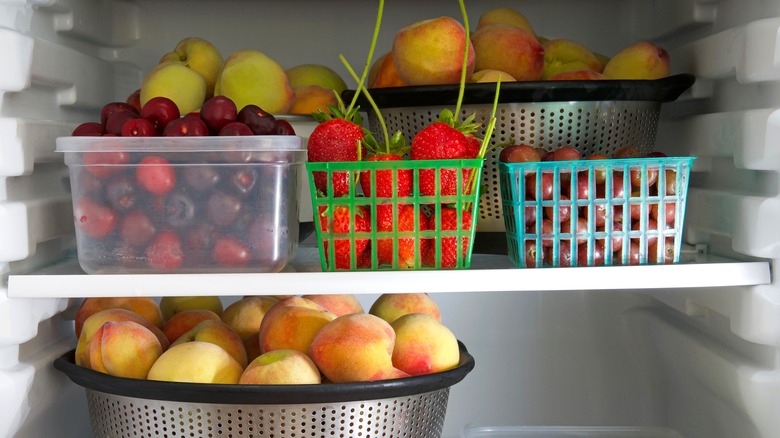 containers of fruit in fridge