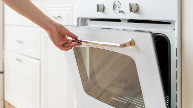 Oven door being opened