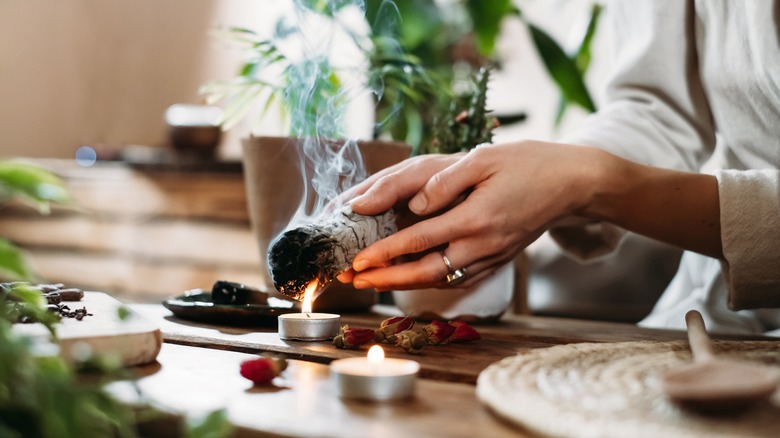 Person preparing for the sage smudging