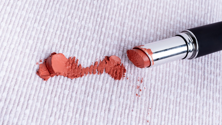 Lipstick rubbed into white fabric