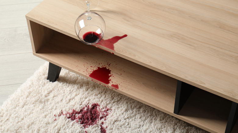 Red wine stain on white carpet