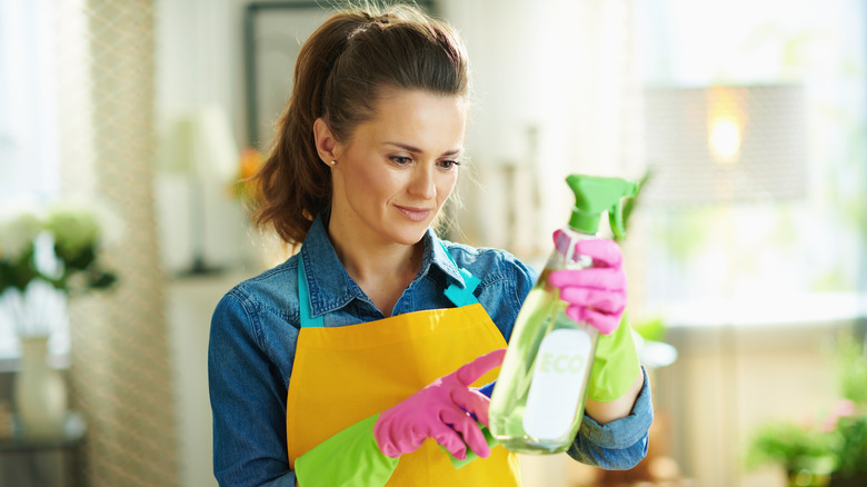 woman checking cleaning product