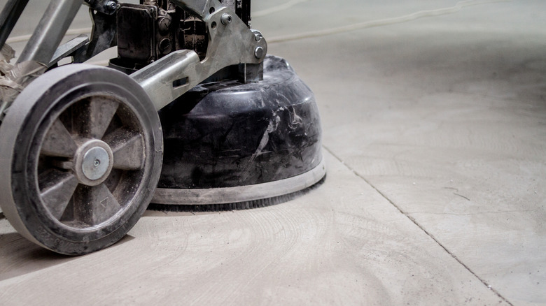 black grinding machine profiling a concrete floor