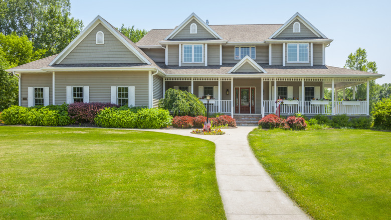 Concrete walkway in front of a house.