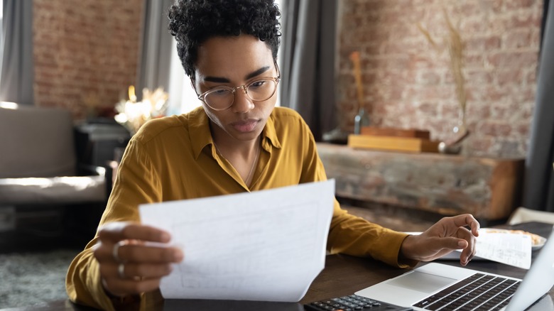 woman looking at laptop