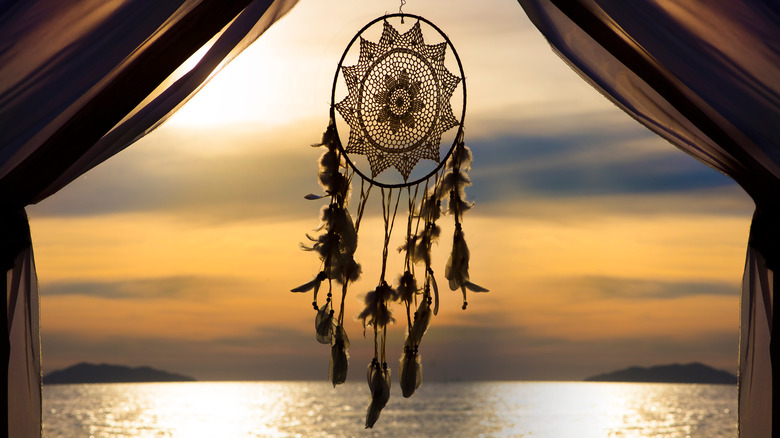 dreamcatcher hanging before sunset