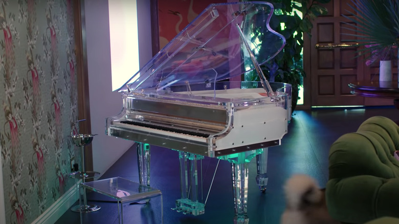 transparent piano in wallpaper room