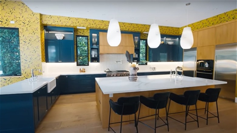 yellow wallpapered kitchen