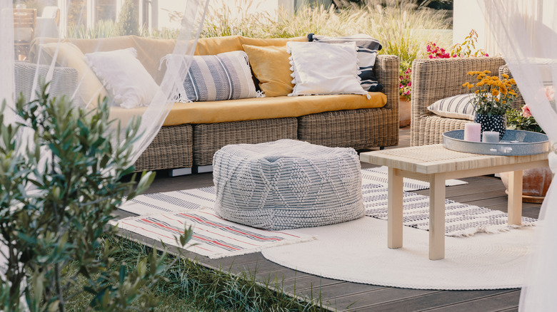 backyard yellow wicker sofa