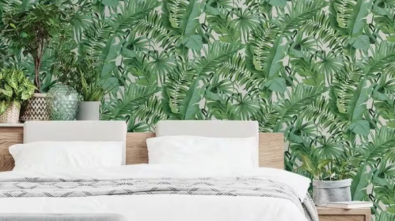 Bedroom with palm tree wallpaper