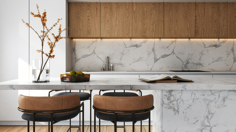 marble kitchen with wood cabinets