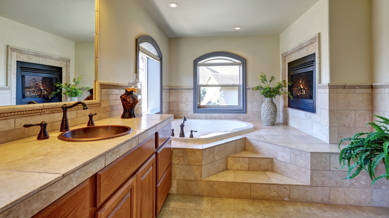 fireplace next to a tub