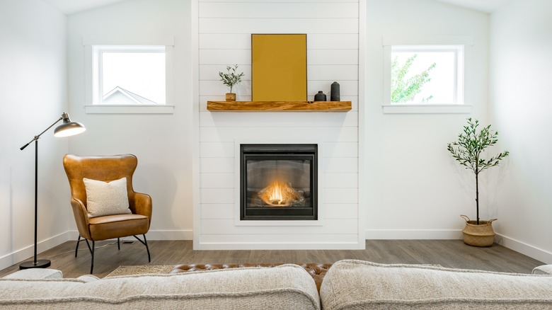 white fireplace with empty space