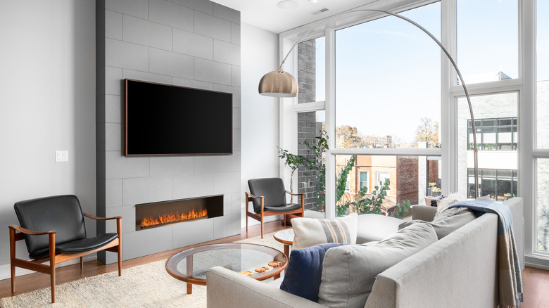 fireplace with TV above it