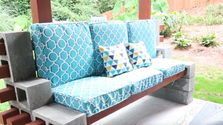 cinderblock garden bench with cushions