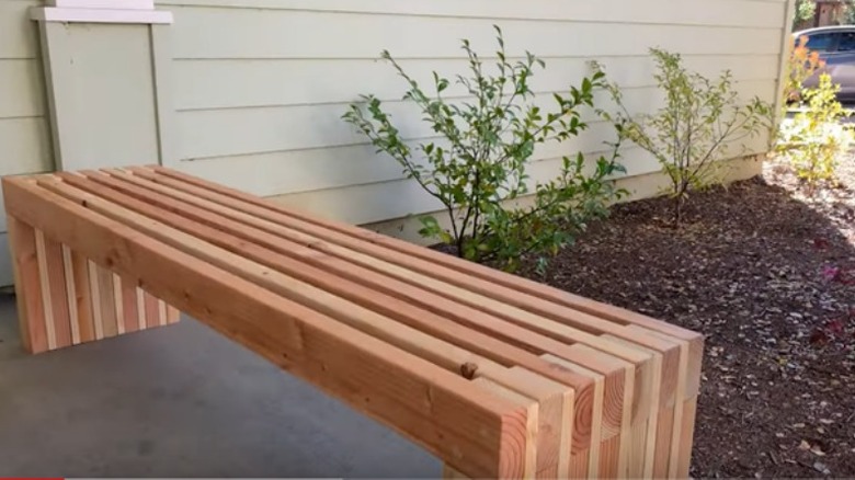 long sleek modern wooden garden bench