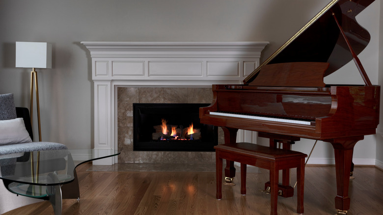 mahogany grand piano with fireplace