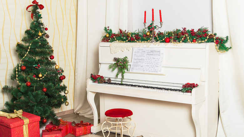 white piano decorated for Christmas