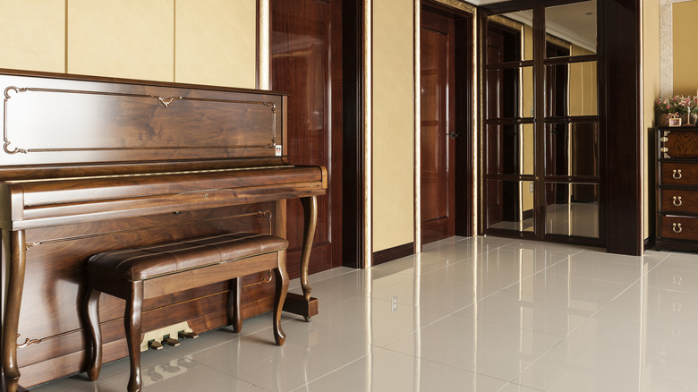 wooden piano with matching doors