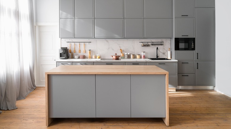 gray kitchen with wooden accents