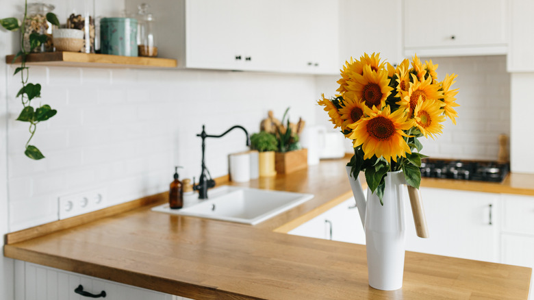 sunflowers in vase white kitchen