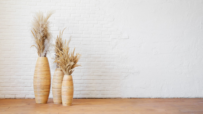 three vases on floor