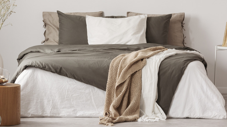 Bed layered with throw blankets