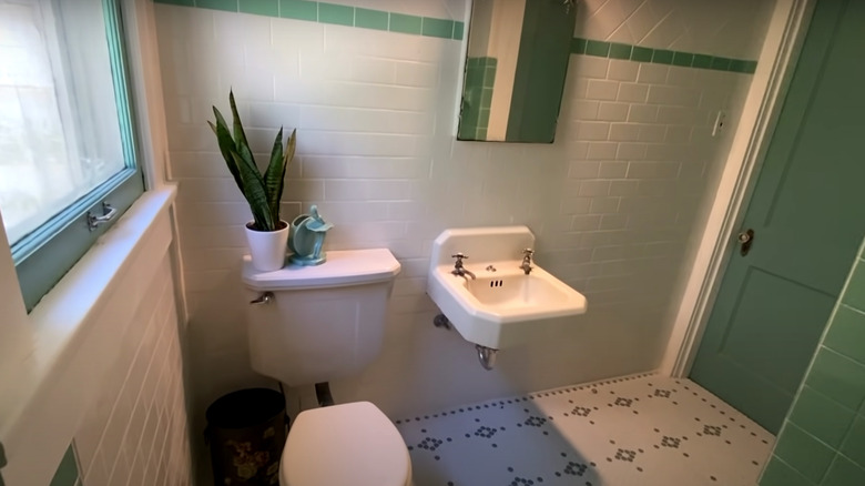 retro bathroom with green tile