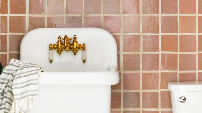 bathroom with brown tile wall