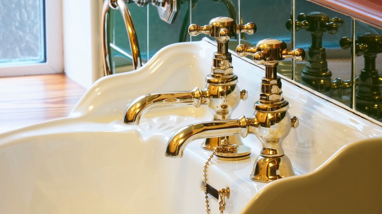 gold faucet white bathroom sink