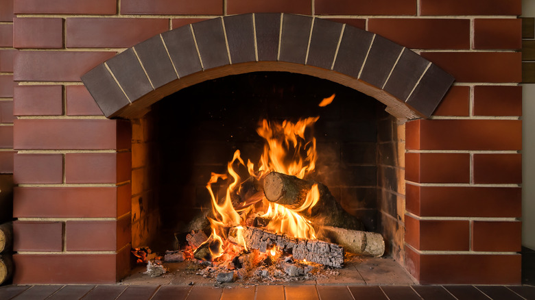 brick fireplace with fire