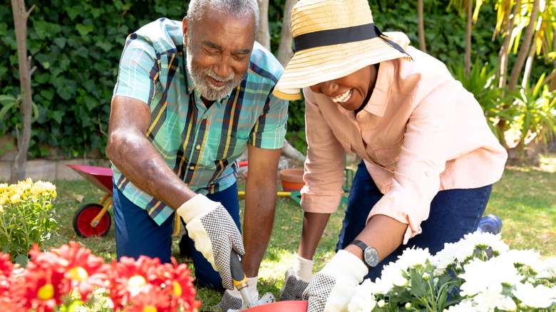 couple planting flowers